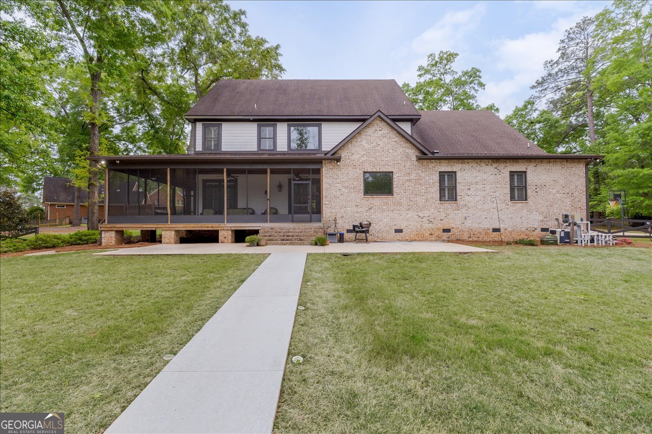 1031 Cherokee Road Perry, GA 31069 - Photo 92 of 104 a front view of house with yard and green space