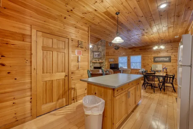 a kitchen with stainless steel appliances a stove a sink and cabinets