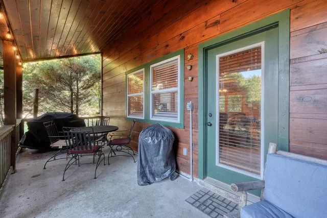 a view of patio with couple of chairs