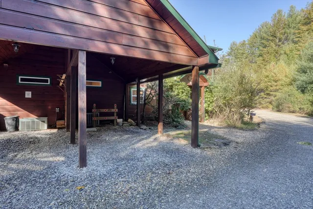 a view of a house with backyard porch and sitting area