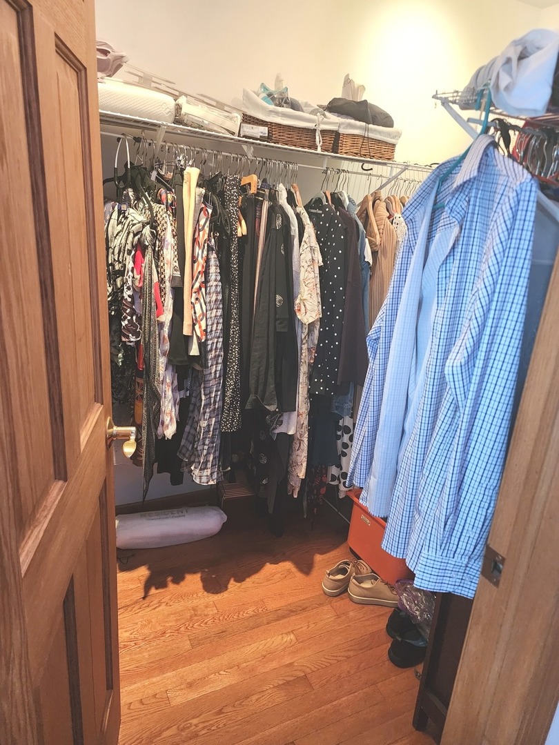 448 Bridle Trail, Unit 448 Wheeling, IL 60090 - Photo 12 of 14 a view of walk in closet with clothes