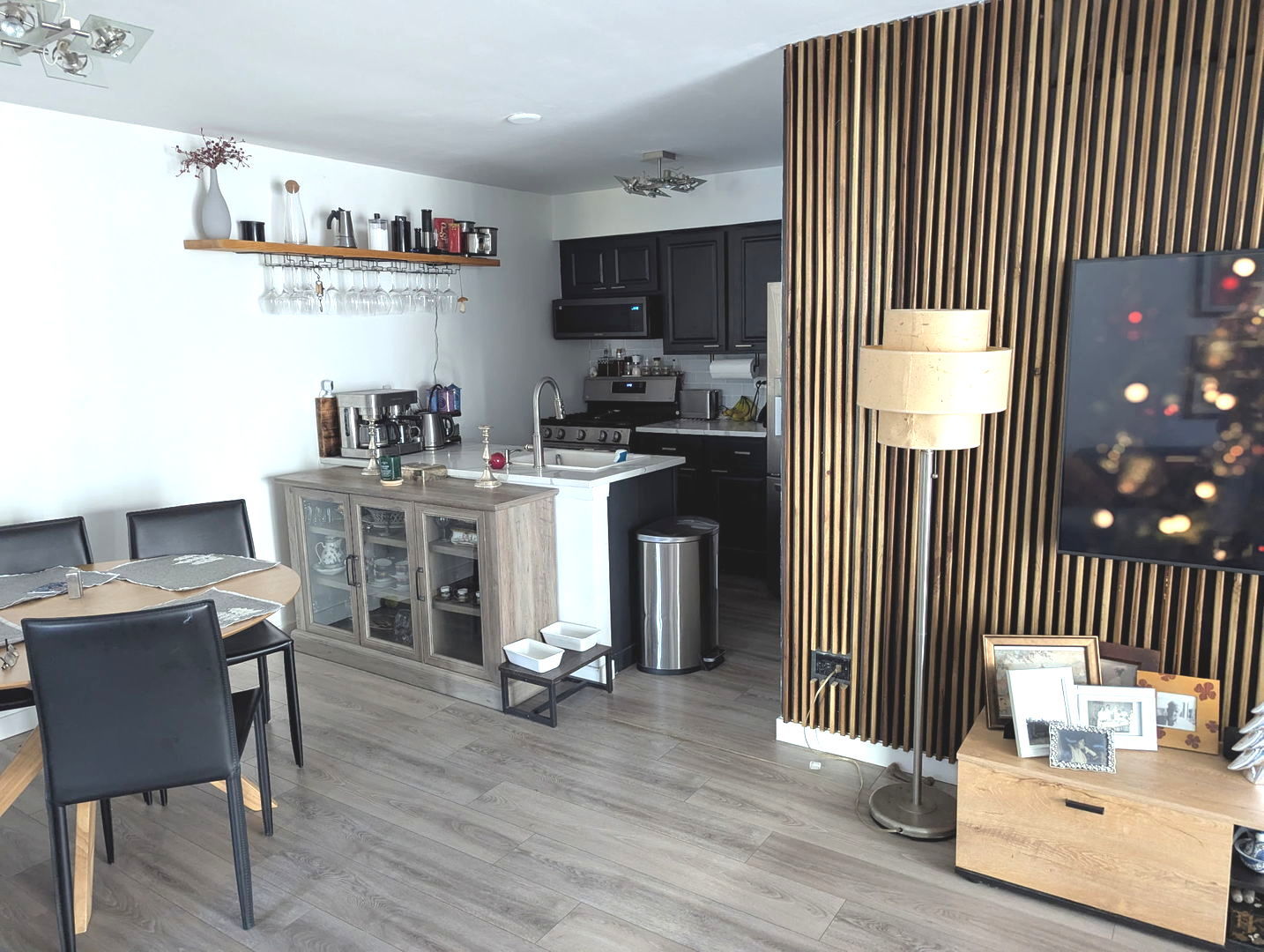 448 Bridle Trail, Unit 448 Wheeling, IL 60090 - Photo 8 of 14 a kitchen with cabinets and wooden floor