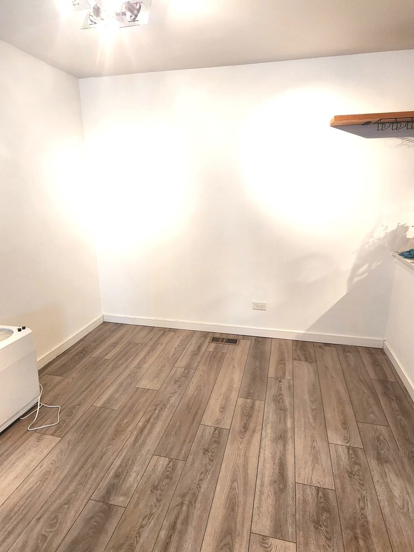 448 Bridle Trail, Unit 448 Wheeling, IL 60090 - Photo 9 of 14 a view of a room with wooden floor