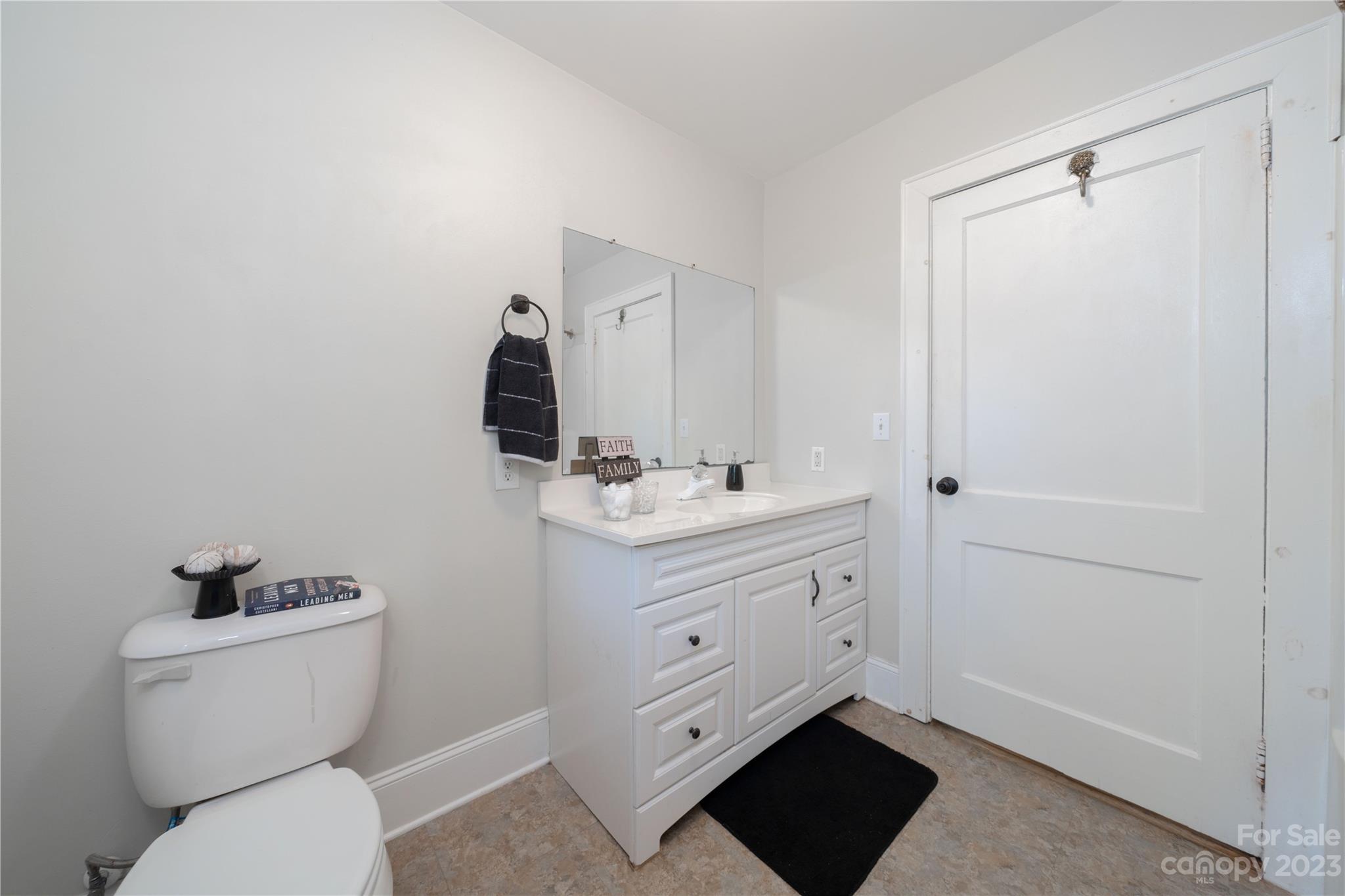 507 Cook Street Kannapolis, NC 28083 - Photo 11 of 38 a bathroom with a toilet sink and mirror