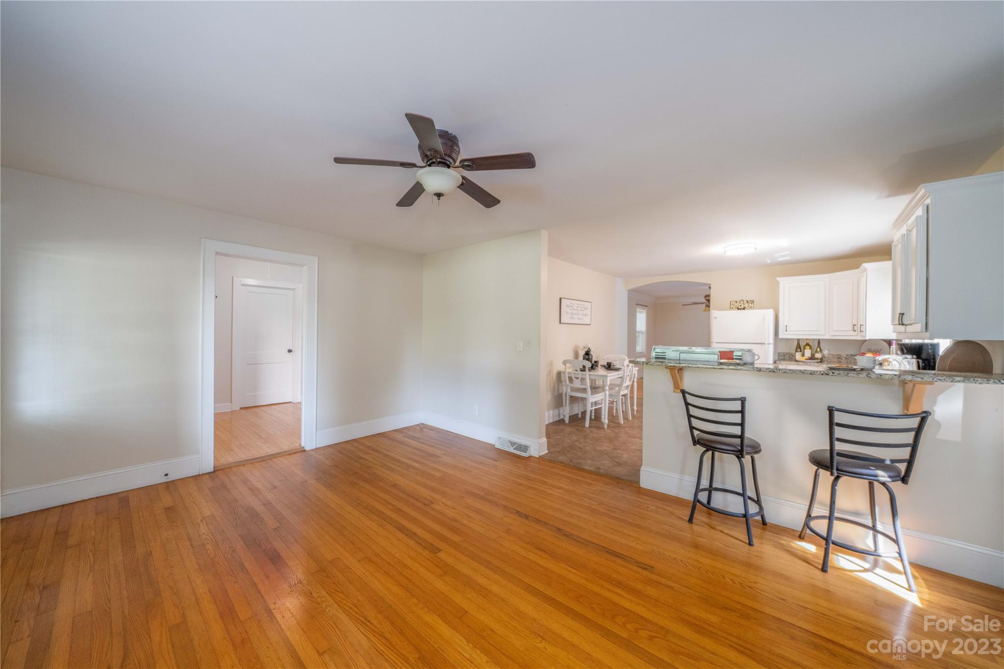 507 Cook Street Kannapolis, NC 28083 - Photo 14 of 38 a view of a dining room with furniture and wooden floor