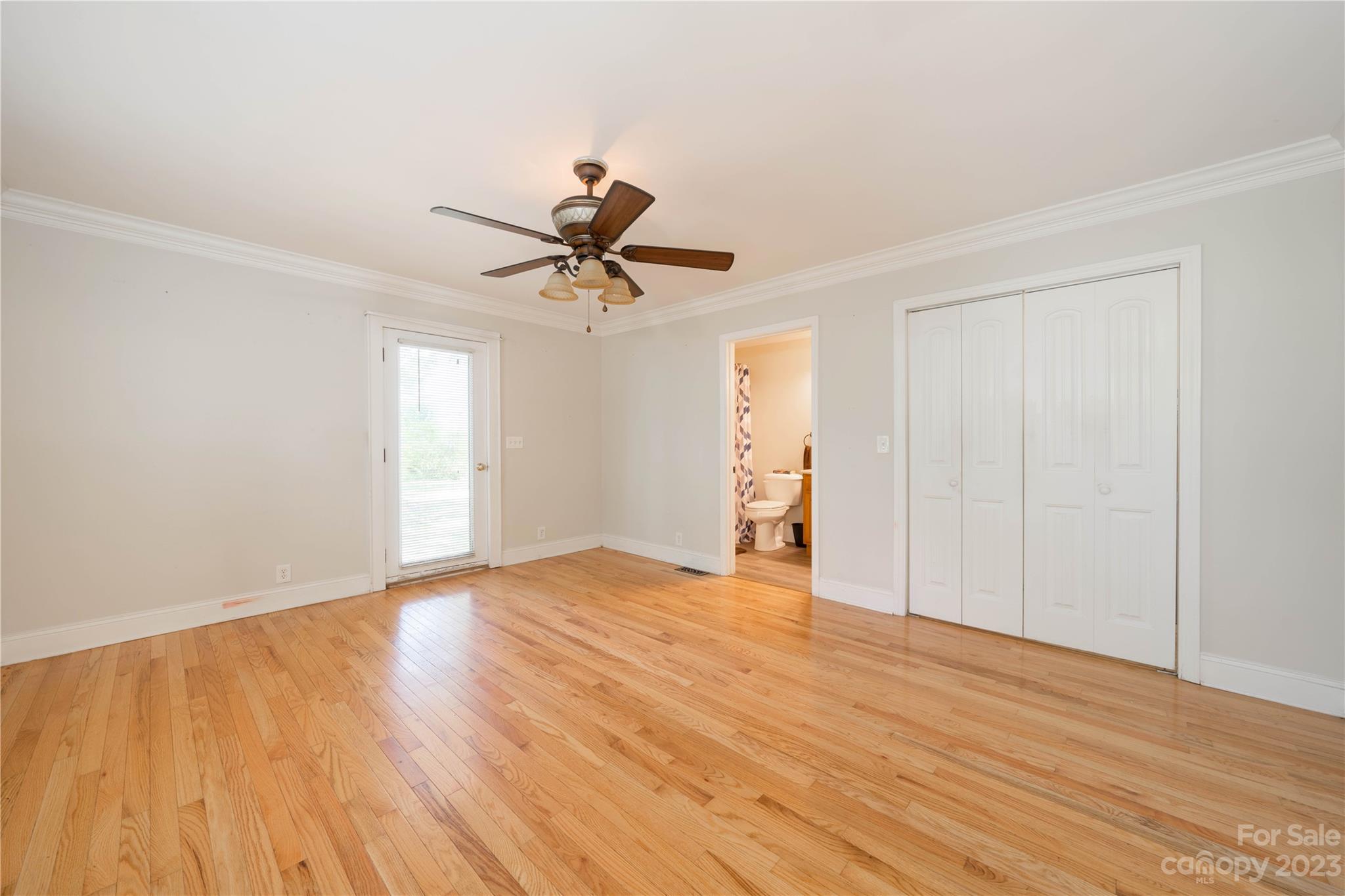 507 Cook Street Kannapolis, NC 28083 - Photo 15 of 38 a view of empty room with wooden floor and fan