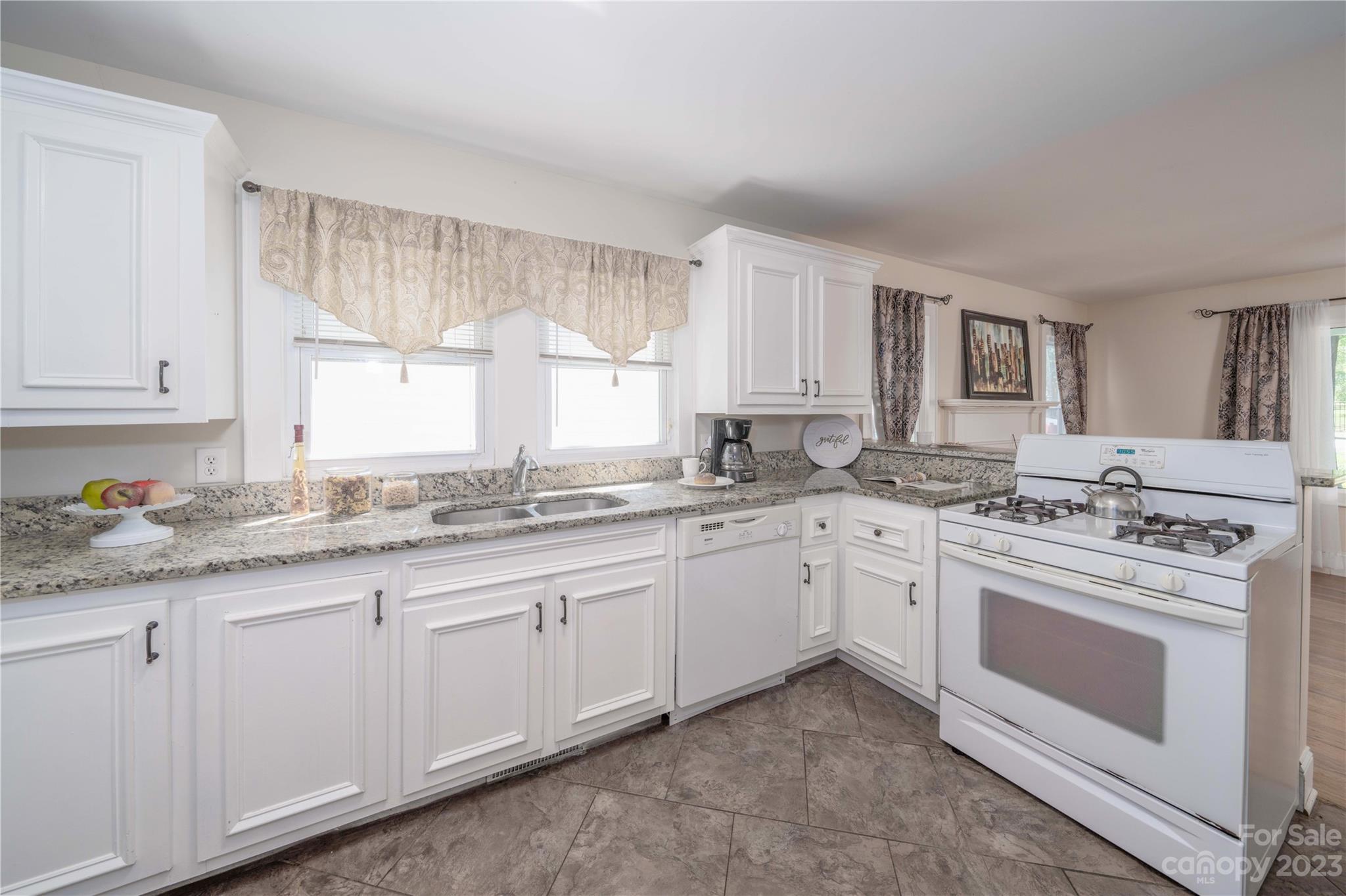 507 Cook Street Kannapolis, NC 28083 - Photo 2 of 38 a kitchen with granite countertop white cabinets and white stainless steel appliances