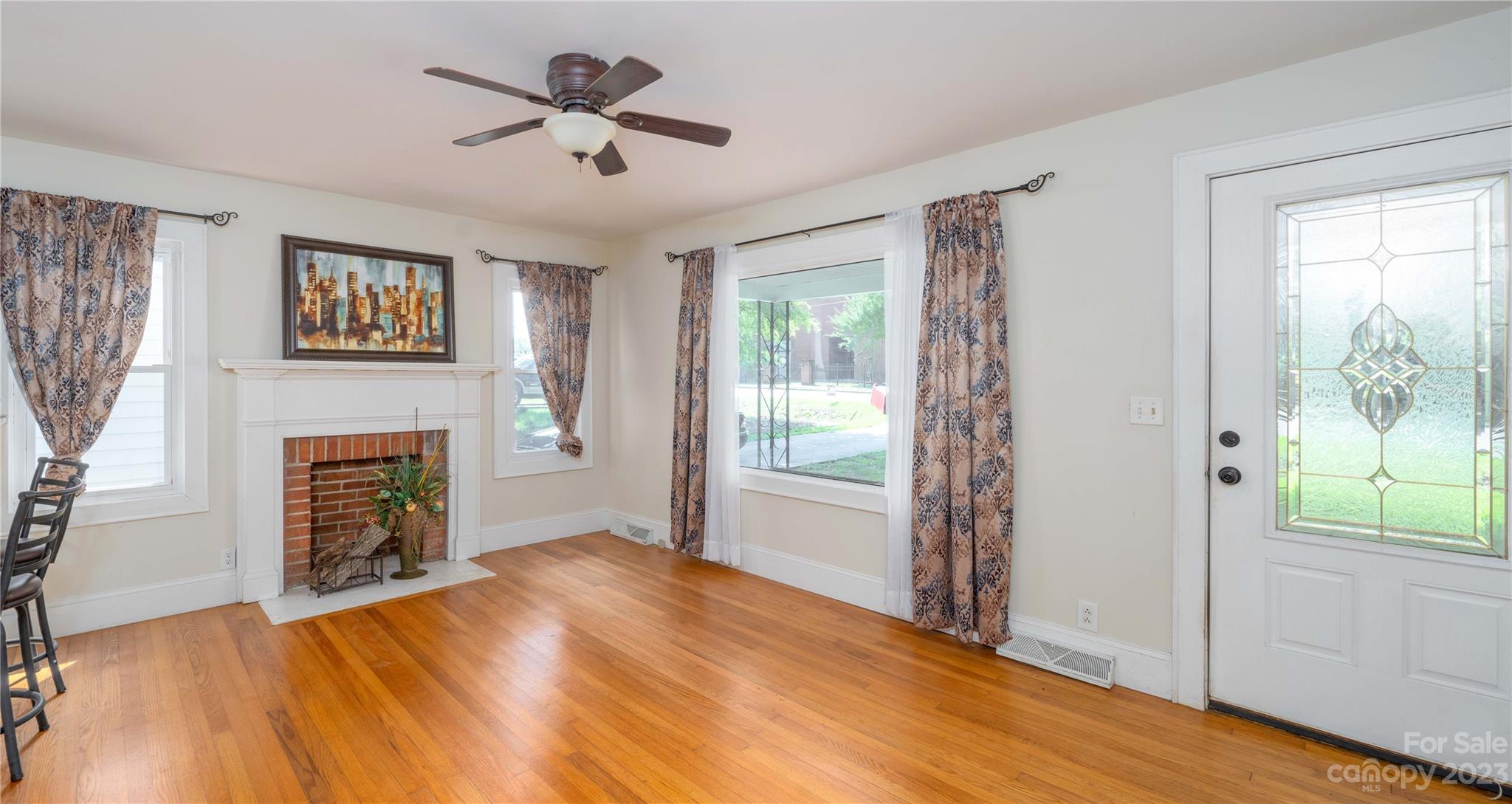 507 Cook Street Kannapolis, NC 28083 - Photo 22 of 38 a furnished livingroom with a bed and a fireplace
