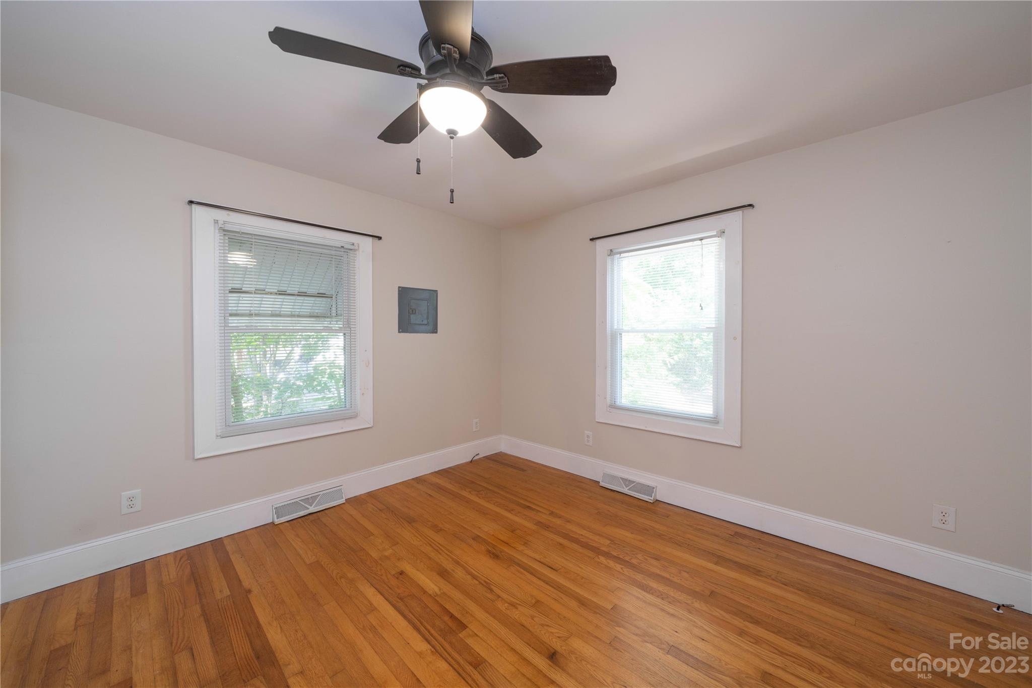 507 Cook Street Kannapolis, NC 28083 - Photo 28 of 38 a view of an empty room with wooden floor and a window