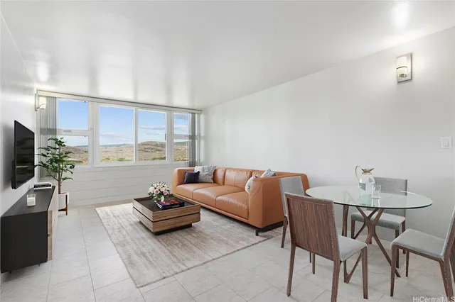 a living room with furniture and a window