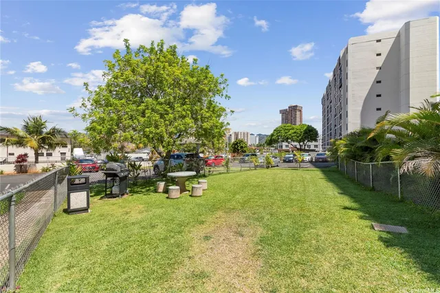 a living room with lots of furniture and white walls