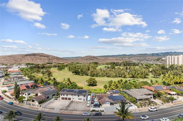 a kitchen with stainless steel appliances granite countertop a sink a stove and a microwave oven