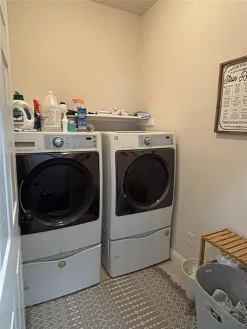 a utility room with dryer and washer