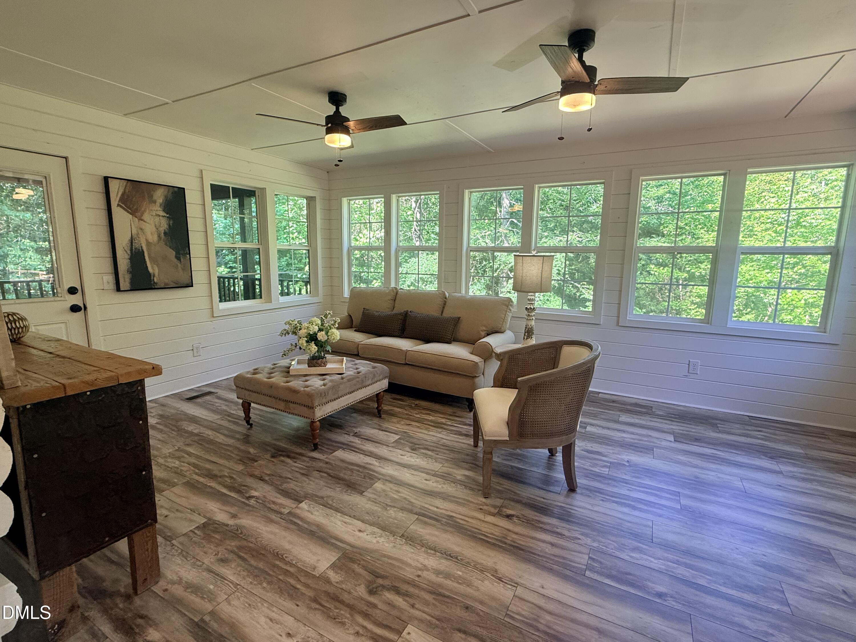 327 Shady Oak Road Roxboro, NC 27574 - Photo 16 of 62 a living room with furniture and a large window