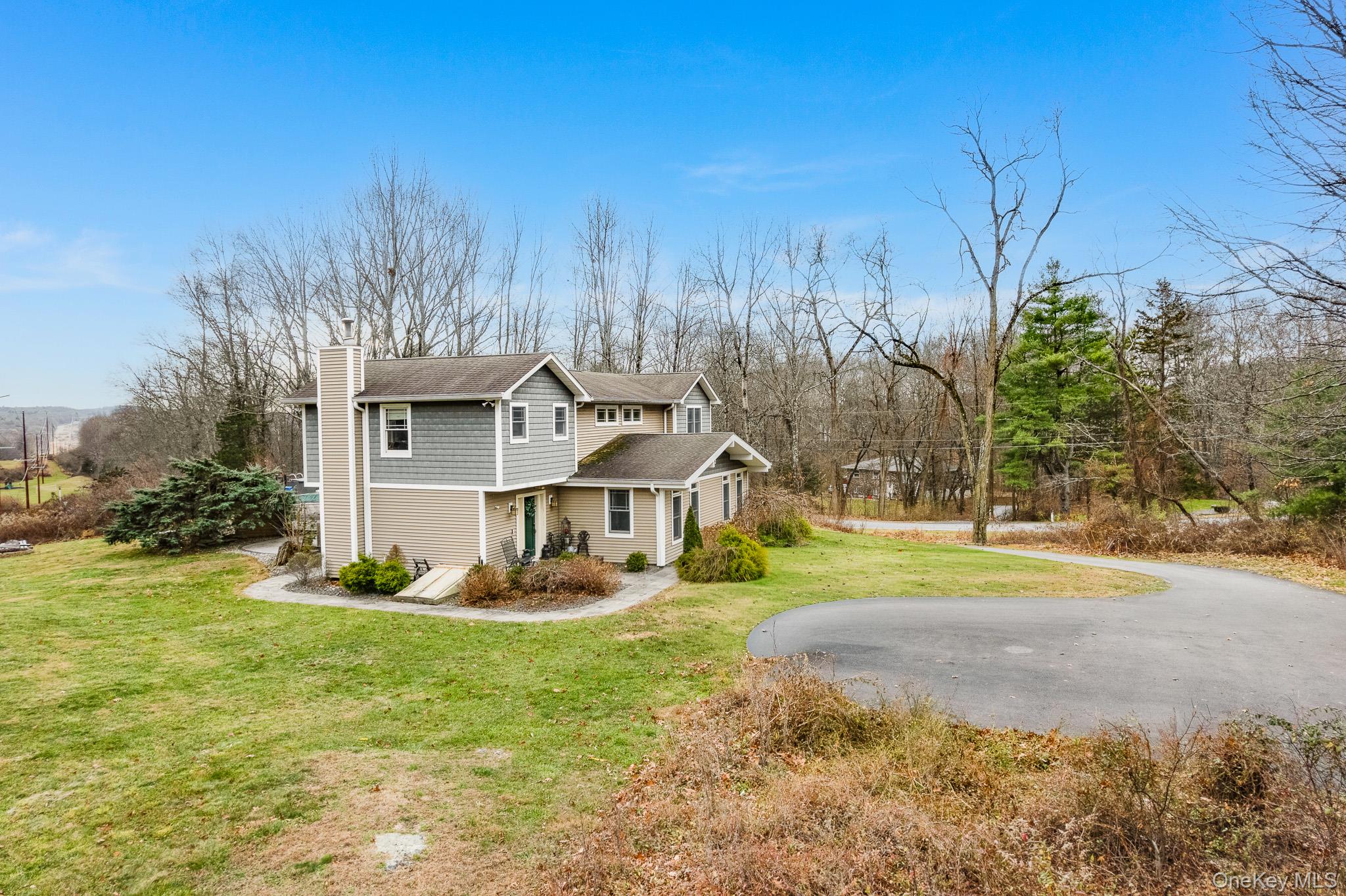 112 Pleasantview Road Pleasant Valley, NY 12569 - Photo 1 of 30 View of front facade featuring a front yard, a chimney, and a porch