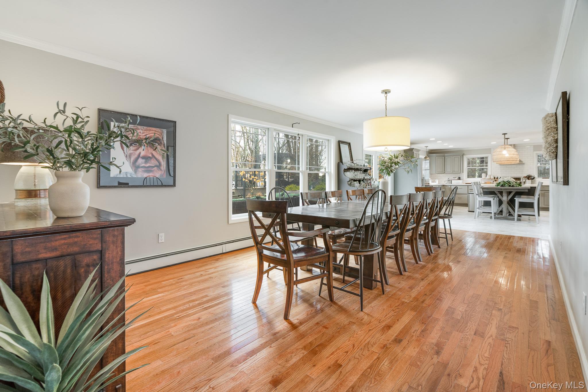 112 Pleasantview Road Pleasant Valley, NY 12569 - Photo 12 of 30 Dining area featuring plenty of natural light, light wood-style floors, ornamental molding, and a baseboard heating unit
