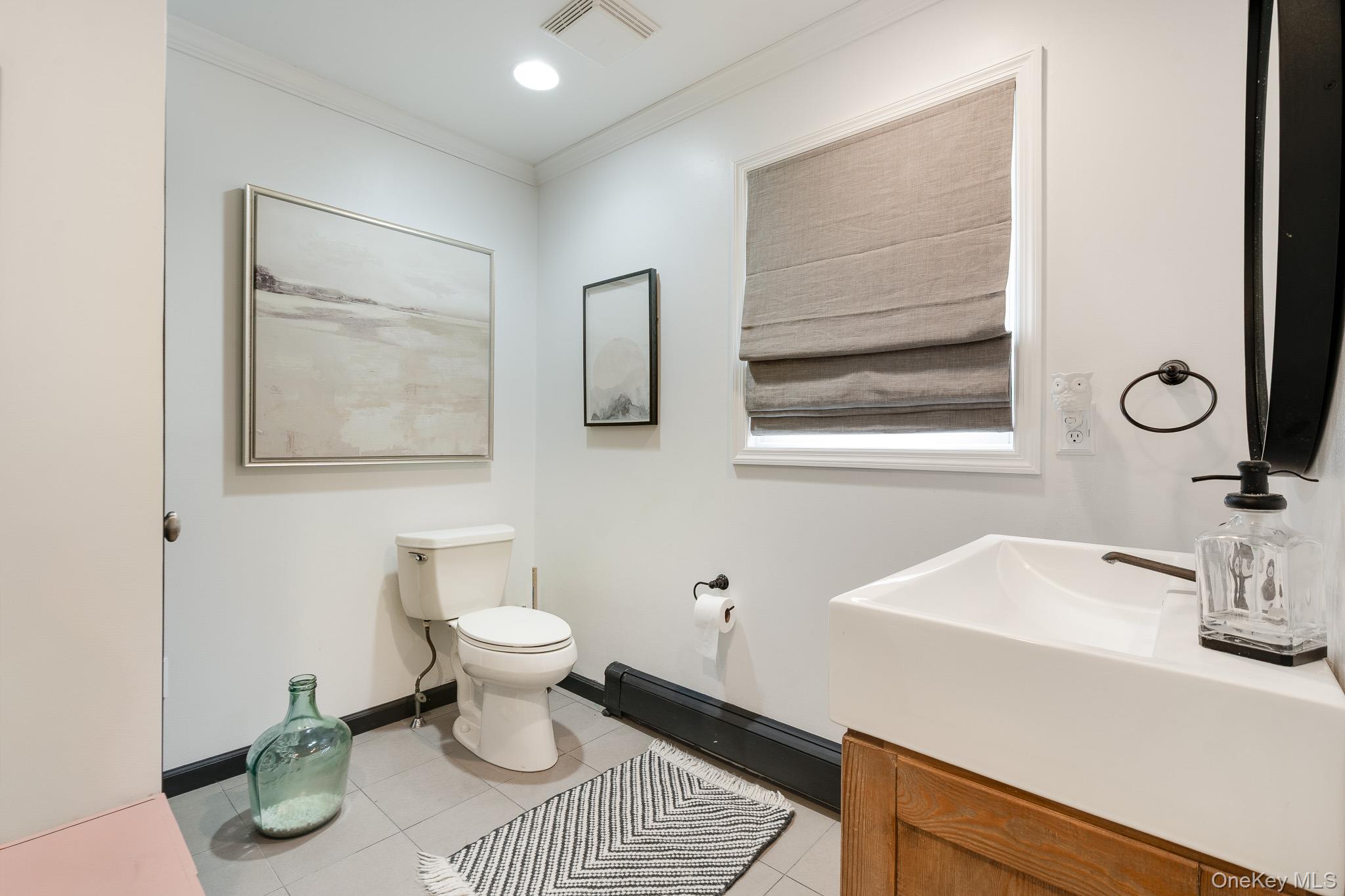 112 Pleasantview Road Pleasant Valley, NY 12569 - Photo 14 of 30 Bathroom with baseboard heating, light tile patterned floors, crown molding, vanity, and recessed lighting