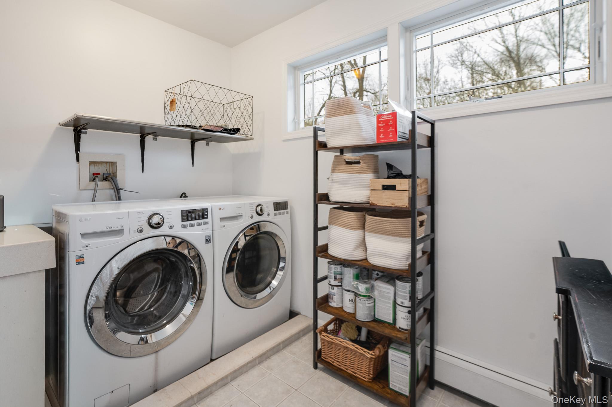 112 Pleasantview Road Pleasant Valley, NY 12569 - Photo 18 of 30 Laundry room with washer and clothes dryer, baseboard heating, and light tile patterned flooring