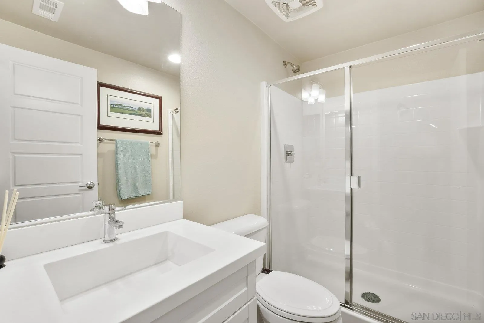4541 Rainier Avenue, Unit 13 San Diego, CA 92120 - Photo 12 of 36 a bathroom with a sink and a mirror