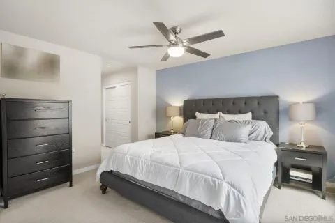 a bedroom with a bed and a dresser