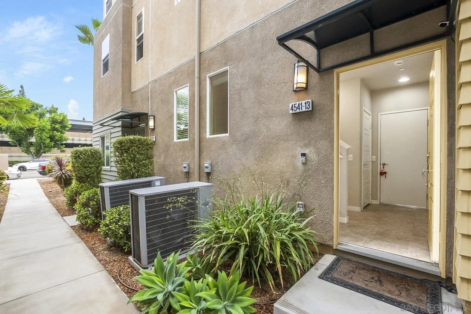 4541 Rainier Avenue, Unit 13 San Diego, CA 92120 - Photo 4 of 36 a view of a glass door with a glass door