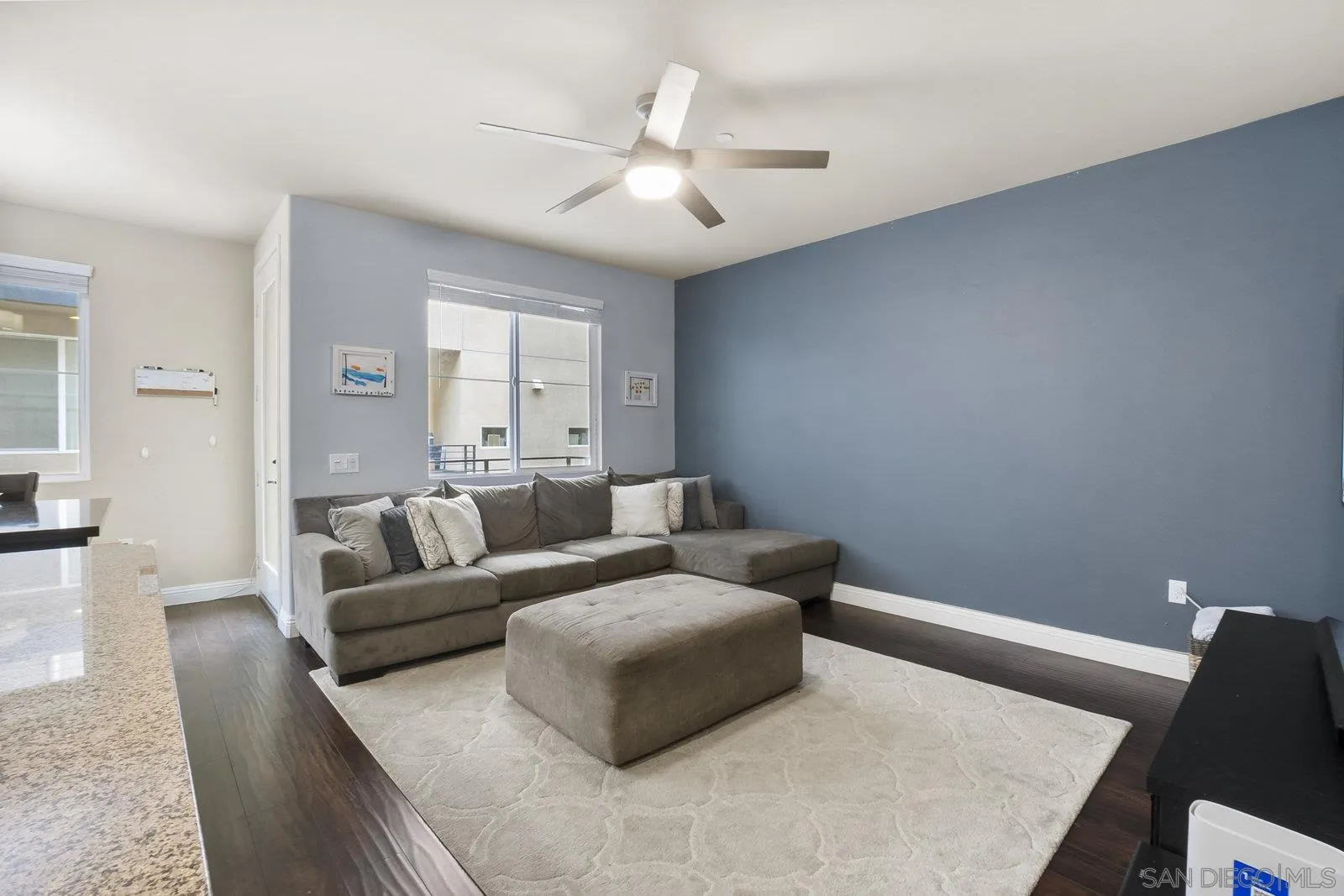 4541 Rainier Avenue, Unit 13 San Diego, CA 92120 - Photo 5 of 36 a living room with furniture and a ceiling fan