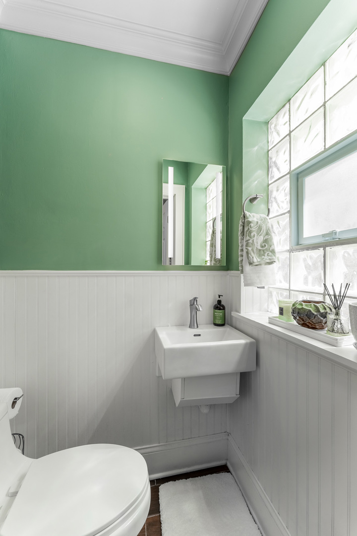 2610 North Major Avenue Chicago, IL 60639 - Photo 13 of 45 a bathroom with a sink a toilet and mirror