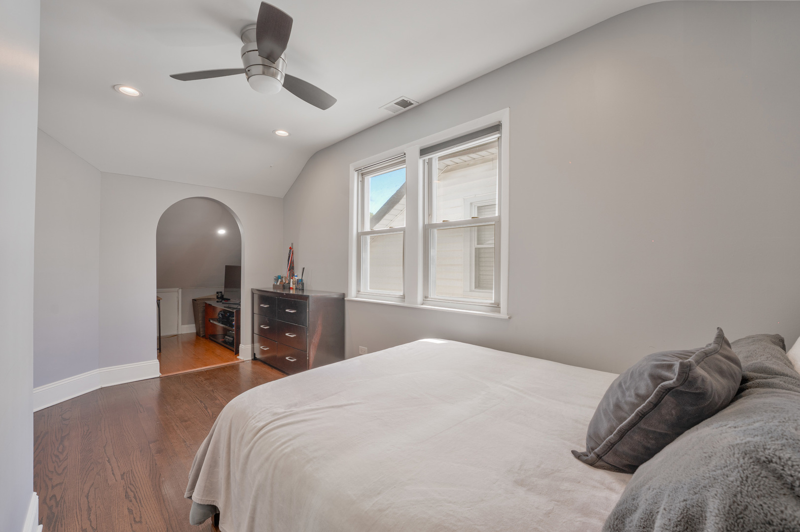 2610 North Major Avenue Chicago, IL 60639 - Photo 16 of 45 a bedroom with a large bed and a wooden floor