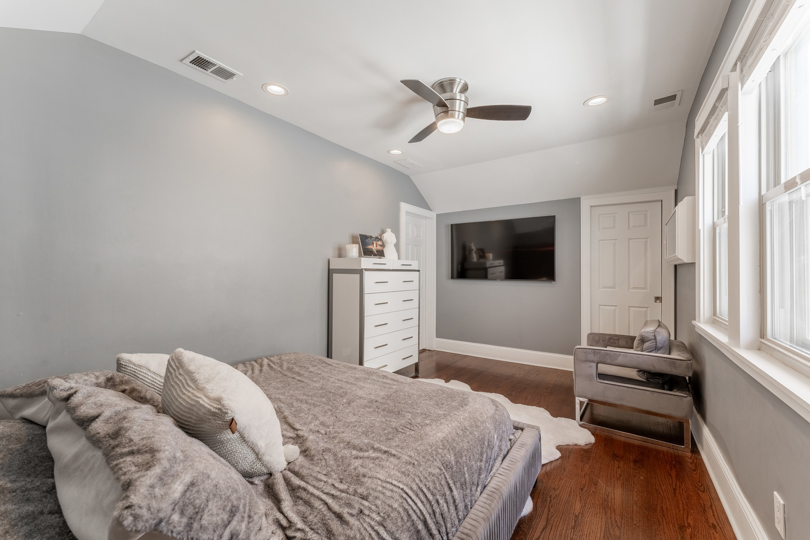 2610 North Major Avenue Chicago, IL 60639 - Photo 18 of 45 a bedroom with a bed and a flat screen tv