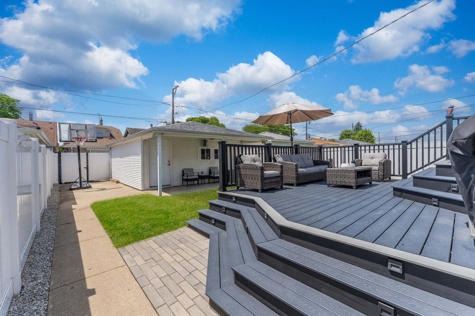 2610 North Major Avenue Chicago, IL 60639 - Photo 32 of 45 a view of a patio with table and chairs with wooden floor and fence