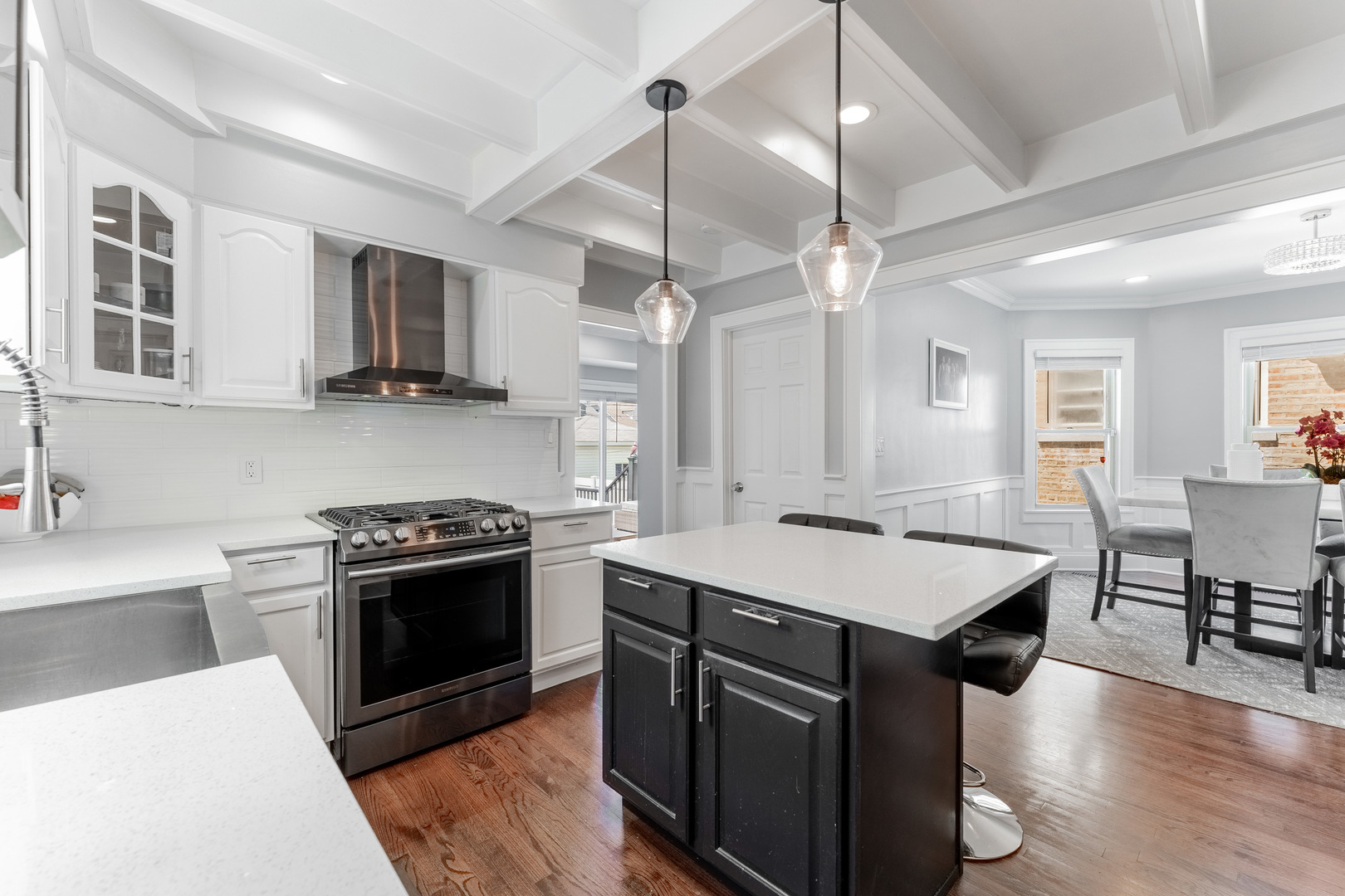 2610 North Major Avenue Chicago, IL 60639 - Photo 9 of 45 a kitchen with stainless steel appliances granite countertop a sink stove and refrigerator