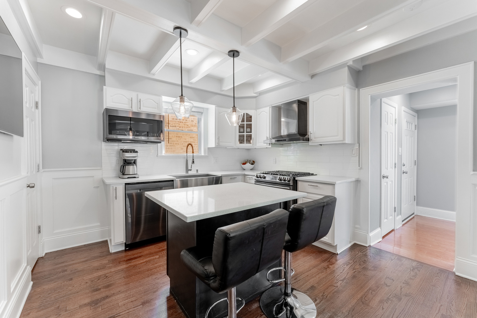 2610 North Major Avenue Chicago, IL 60639 - Photo 10 of 45 a kitchen with stainless steel appliances granite countertop a sink a stove a refrigerator and a microwave