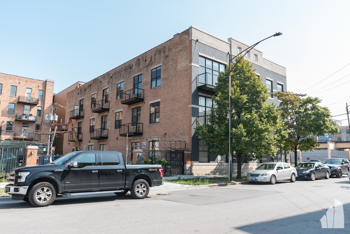 213 North Racine Avenue, Unit 304 Chicago, IL 60607 - Photo 3 of 12 a car parked in front of a building
