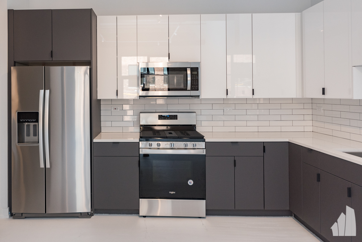 213 North Racine Avenue, Unit 304 Chicago, IL 60607 - Photo 7 of 12 a kitchen with stainless steel appliances granite countertop a refrigerator stove a sink and dishwasher