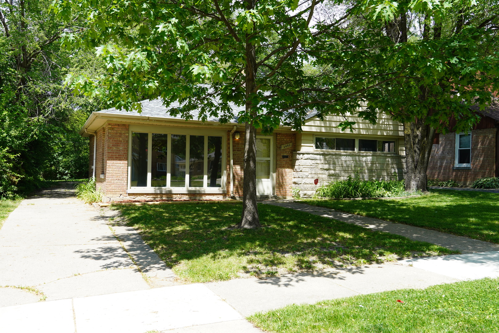 2460 Hawthorne Road Homewood, IL 60430 - Photo 2 of 11 front view of a house with a yard