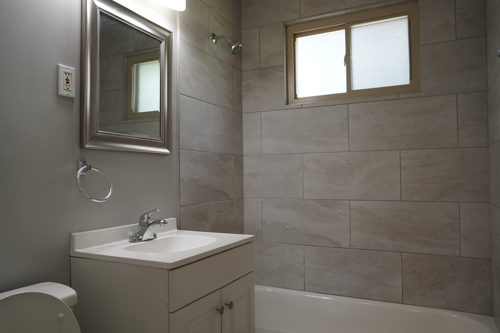 2460 Hawthorne Road Homewood, IL 60430 - Photo 7 of 11 a bathroom with a sink a toilet and mirror