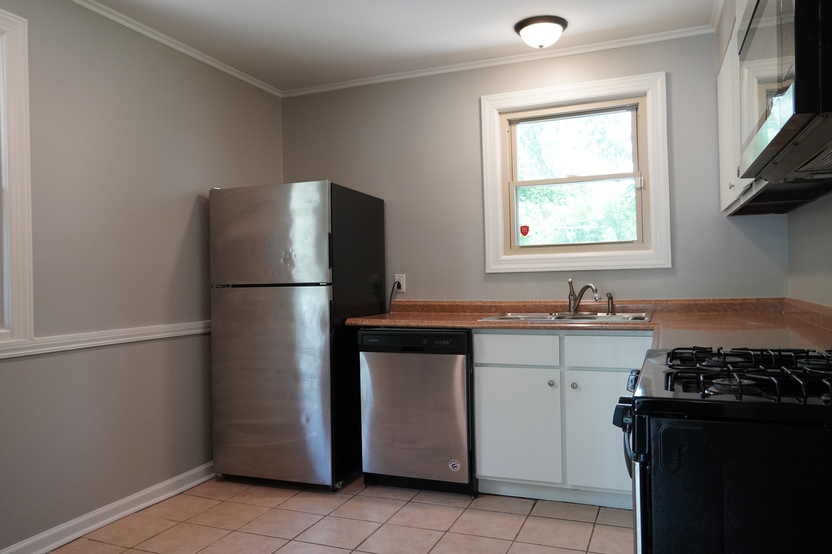 2460 Hawthorne Road Homewood, IL 60430 - Photo 9 of 11 a kitchen with a refrigerator and a sink