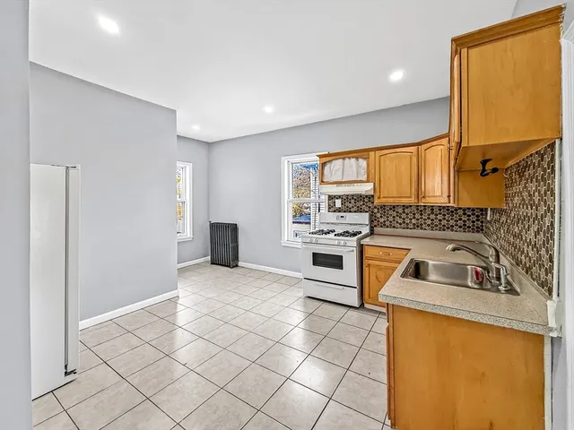 a kitchen with a sink cabinets and a counter top space