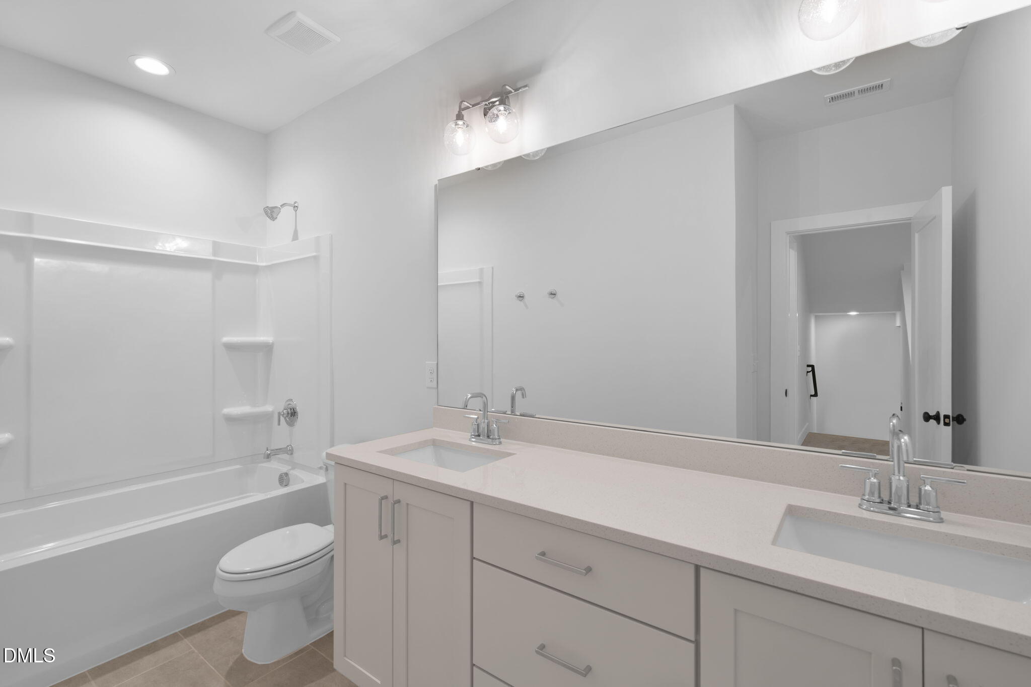 966 Double Helix Road Apex, NC 27523 - Photo 21 of 36 a bathroom with a sink a toilet and shower