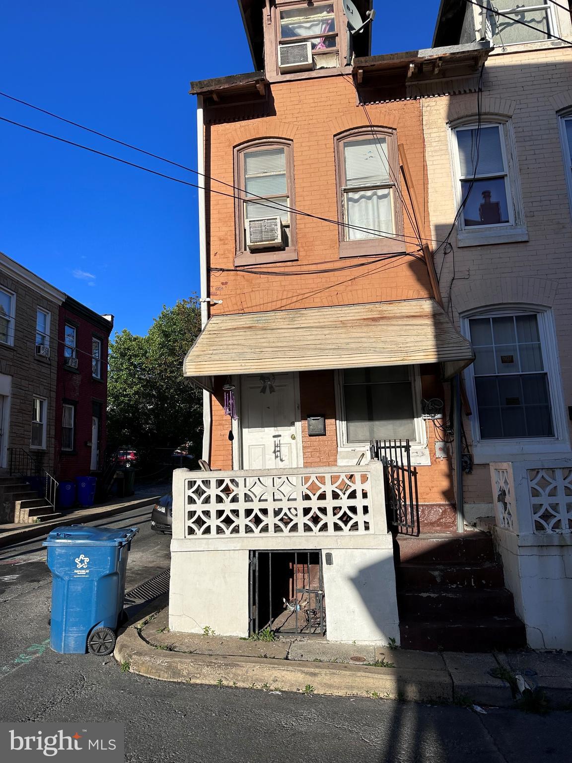 a view of a couches and dinning table in the balcony