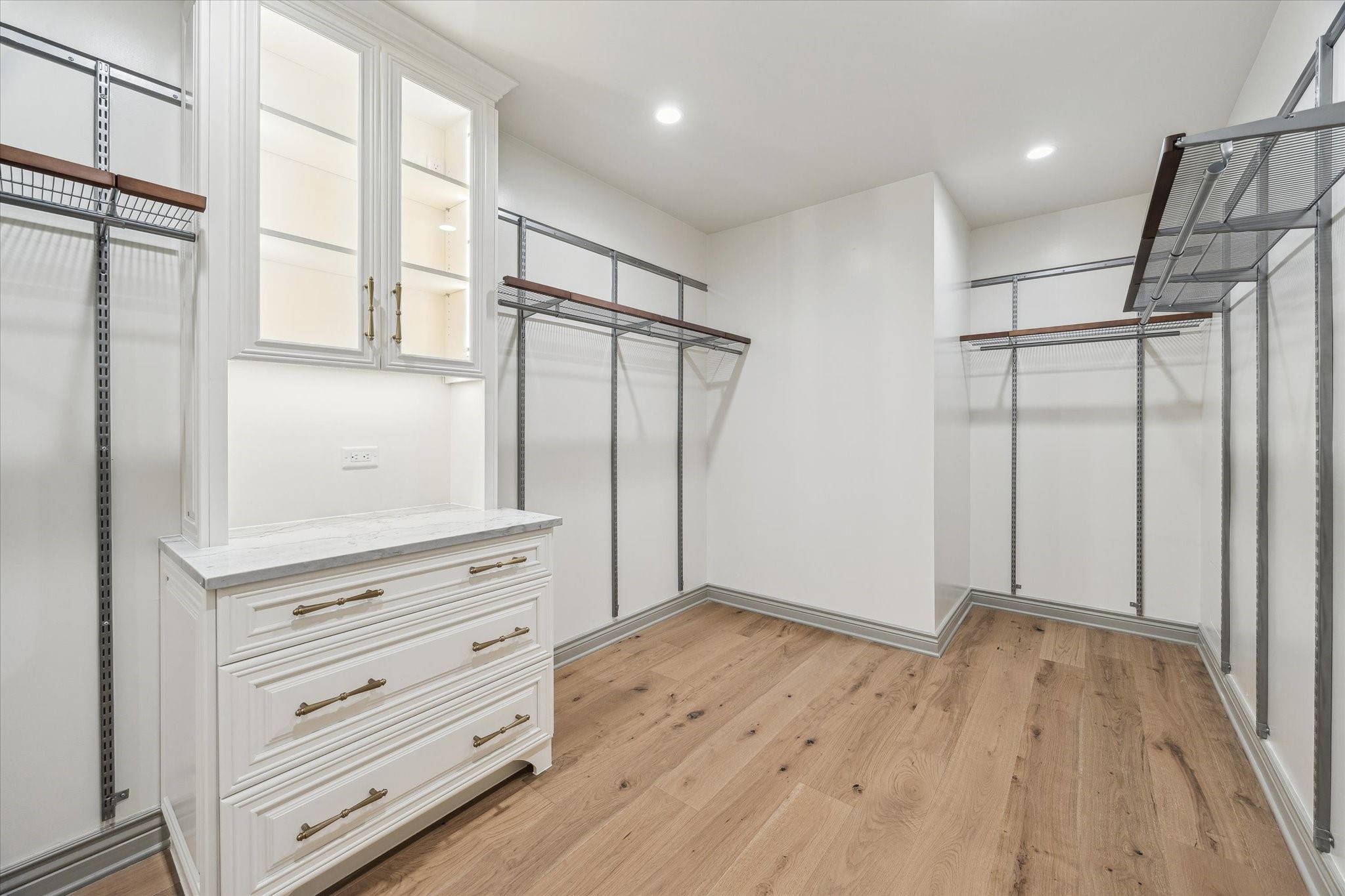 1717 Bissonnet Street, Unit 1105 Houston, TX 77005 - Photo 19 of 32 Another view of the primary closet with built-in cabinetry and adjustable Elfa closet system.