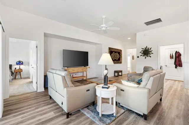 a spacious bedroom with a bed and a table