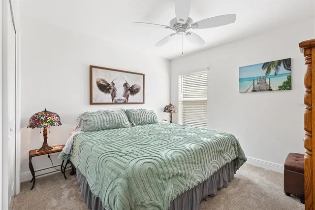 a bedroom with a bed and cabinets