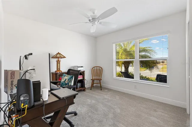 a view of a workspace with furniture