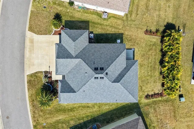 an aerial view of a house with outdoor space