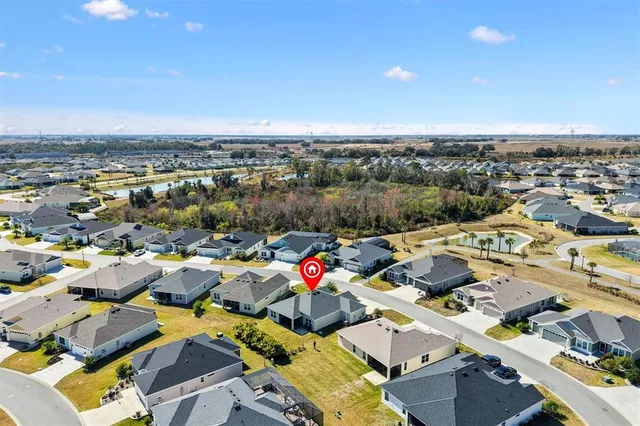an aerial view of a house with a swimming pool