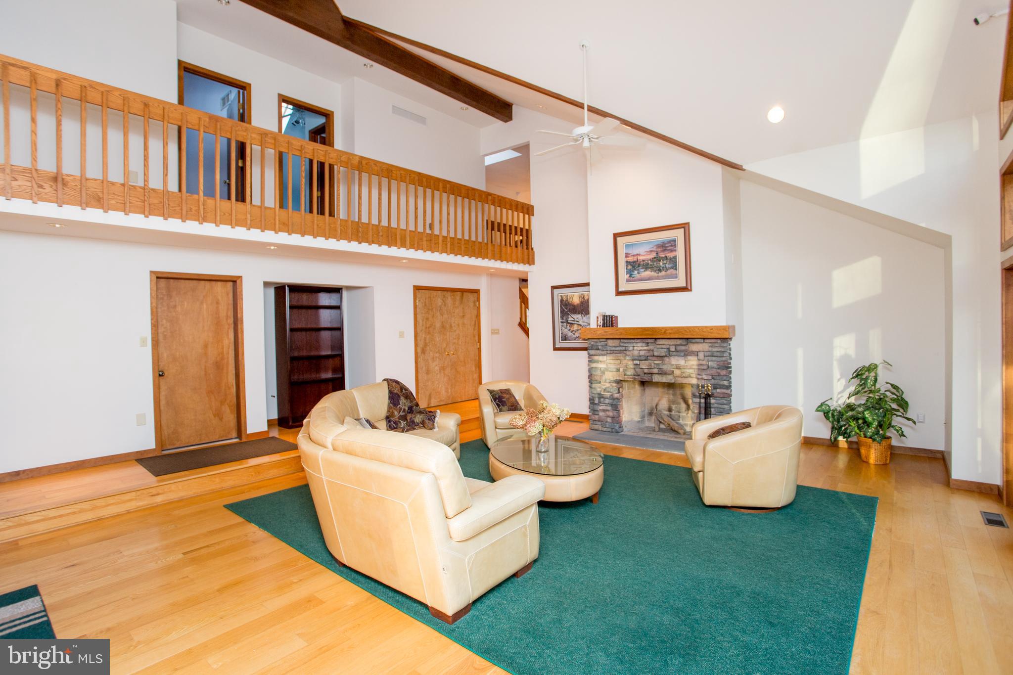 786 Ridge Road Telford, PA 18969 - Photo 48 of 105 a living room with fireplace furniture and a wooden floor
