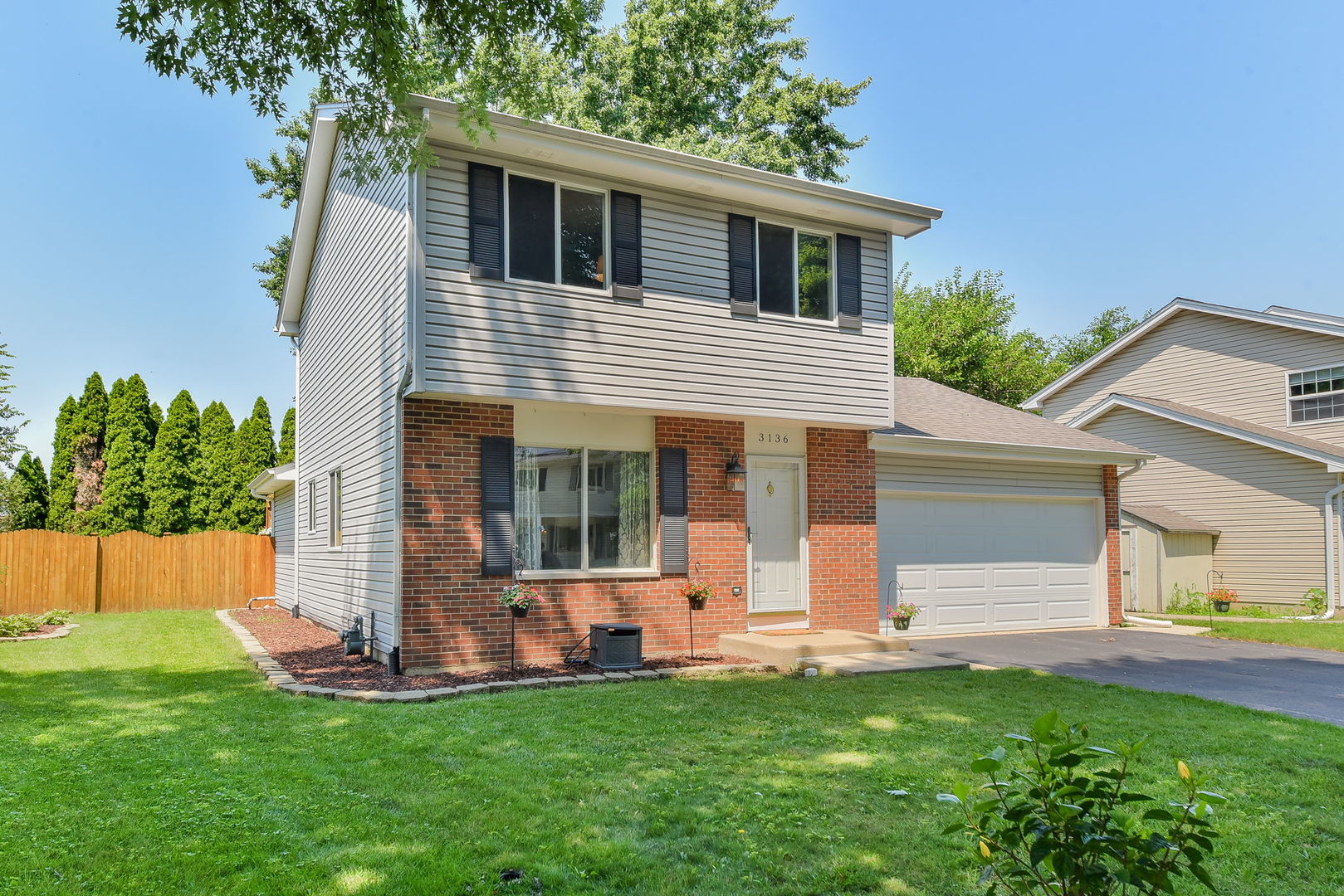 3136 Quincy Lane Aurora, IL 60504 - Photo 1 of 23 front view of a house with a yard