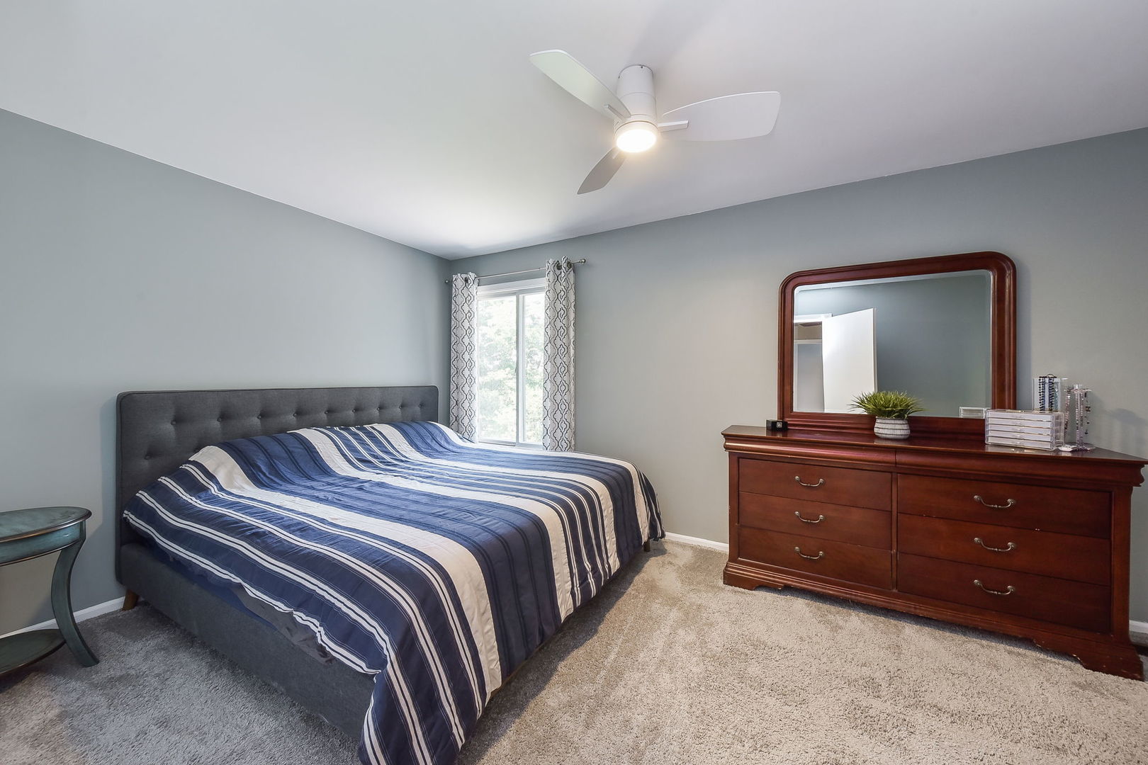 3136 Quincy Lane Aurora, IL 60504 - Photo 14 of 23 a bedroom with a bed and a mirror on dresser
