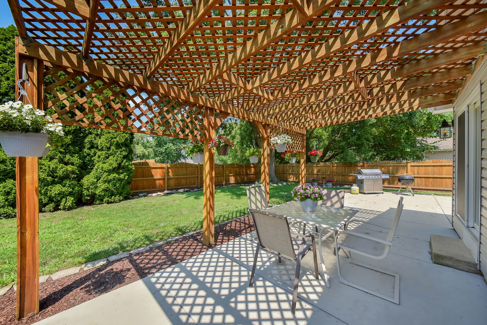 3136 Quincy Lane Aurora, IL 60504 - Photo 19 of 23 a view of a chairs and tables in the back yard of the house